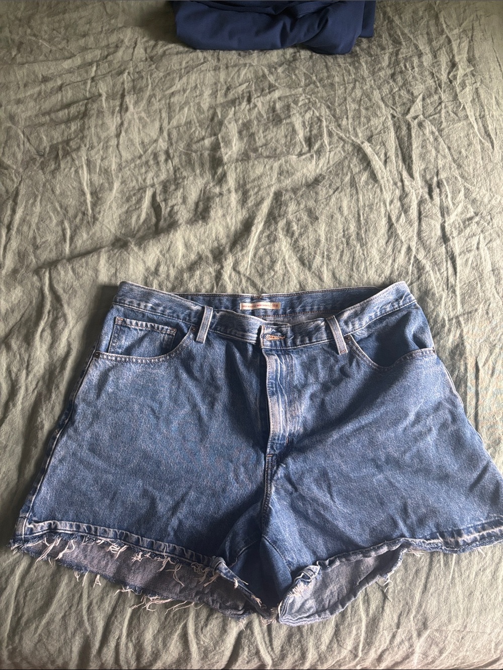 Levi's Medium Blue Frayed Hem Denim Shorts